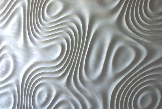 A wall with a contoured surface created from random noise.
